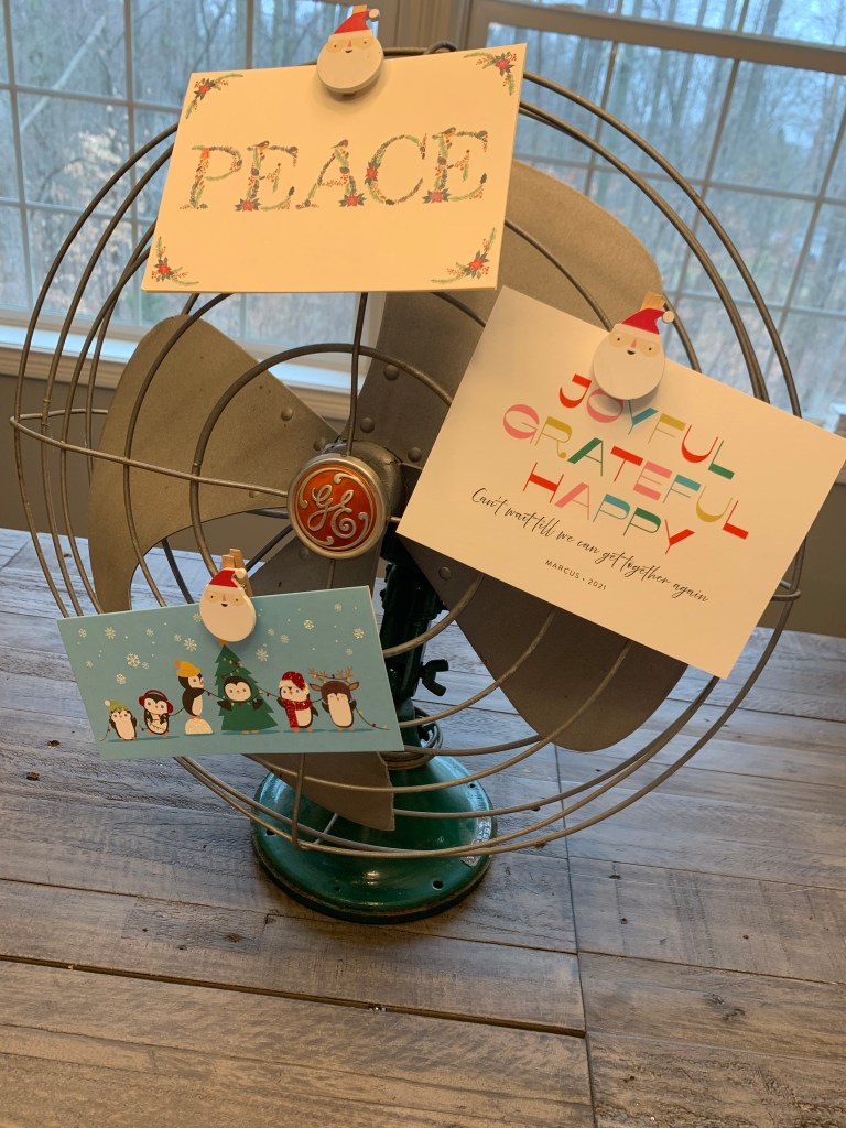Vintage fan used to display Christmas cards